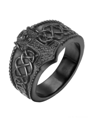 Matte black Thor's hammer gothic men's ring with engraved Mjolnir and Celtic knot design, studio top view