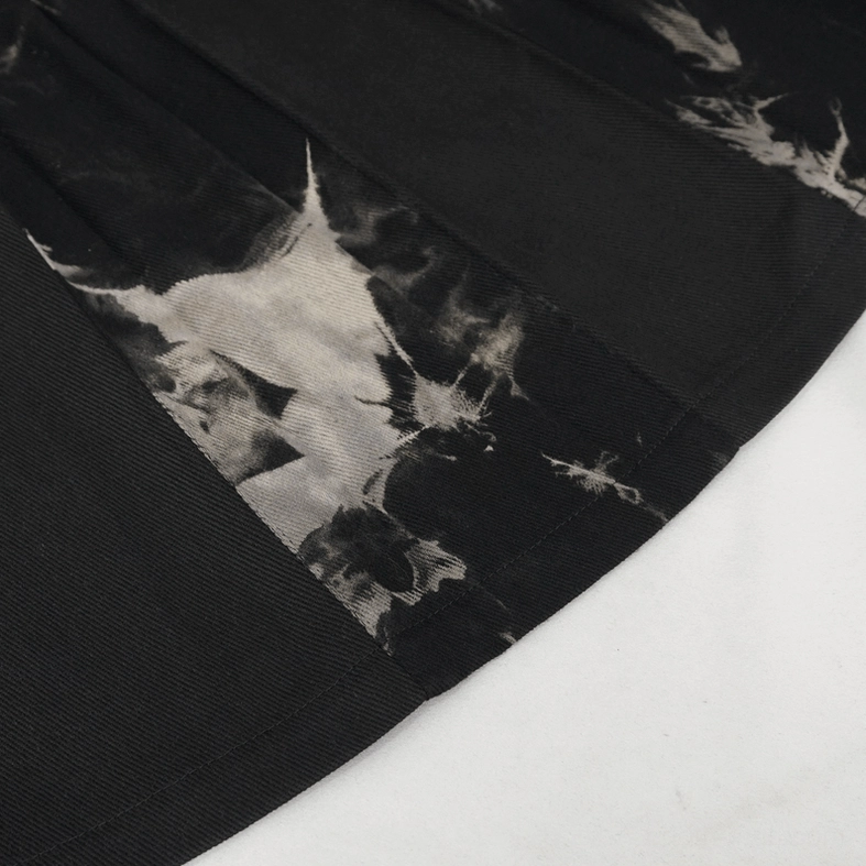Overall product view of tie-dye studded gothic kilt lay flat showing complete design, all hardware, and dimensional silhouette