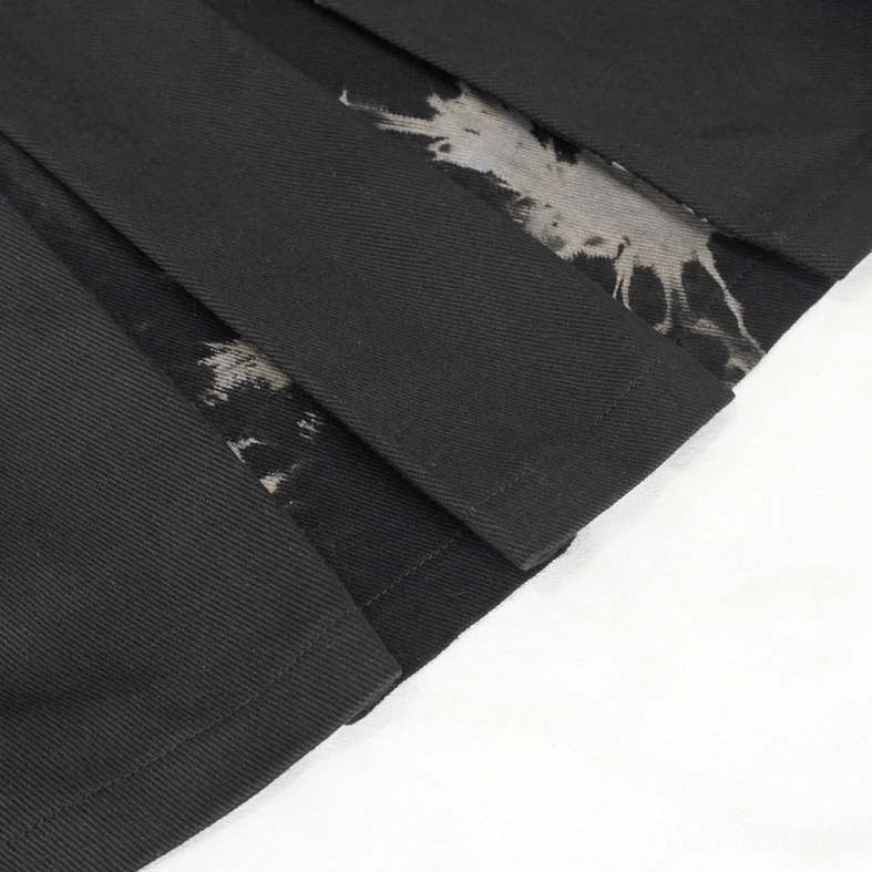 Texture close-up of tie-dye pattern on gothic kilt showing color variation and fabric surface quality