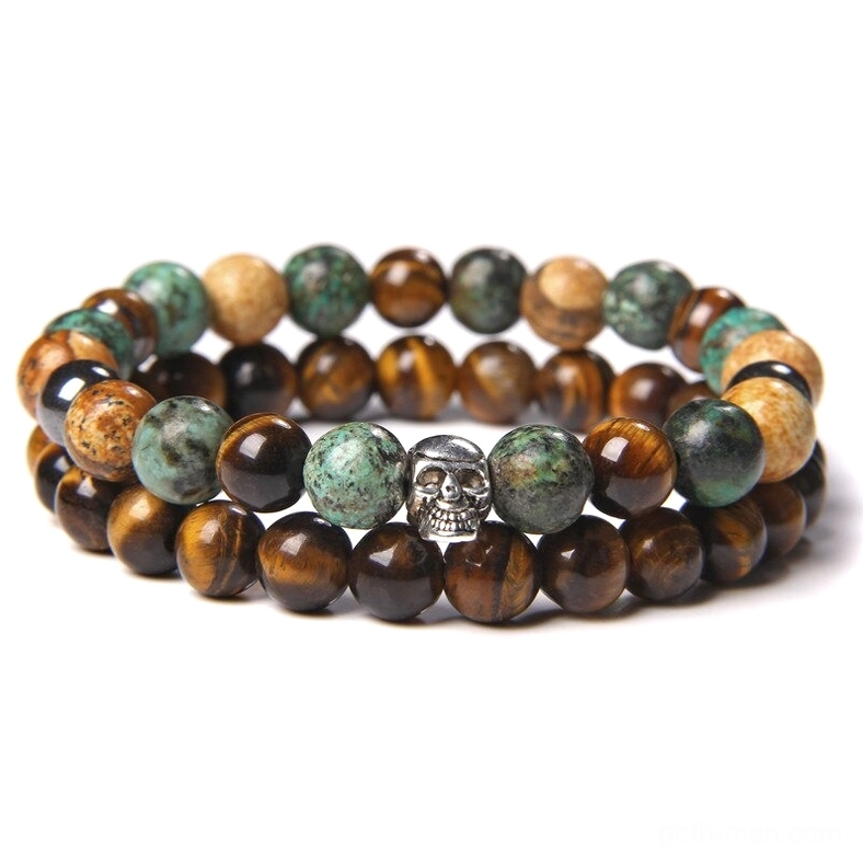 Tiger eye turquoise stone beaded gothic bracelet with skull accent, striped natural stone detail view