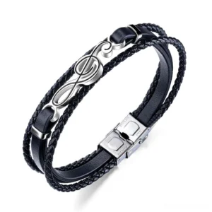 Black treble clef leather bracelet flat lay overhead view showing braided multi-strand PU leather construction with stainless steel music symbol charm gothic mens jewelry