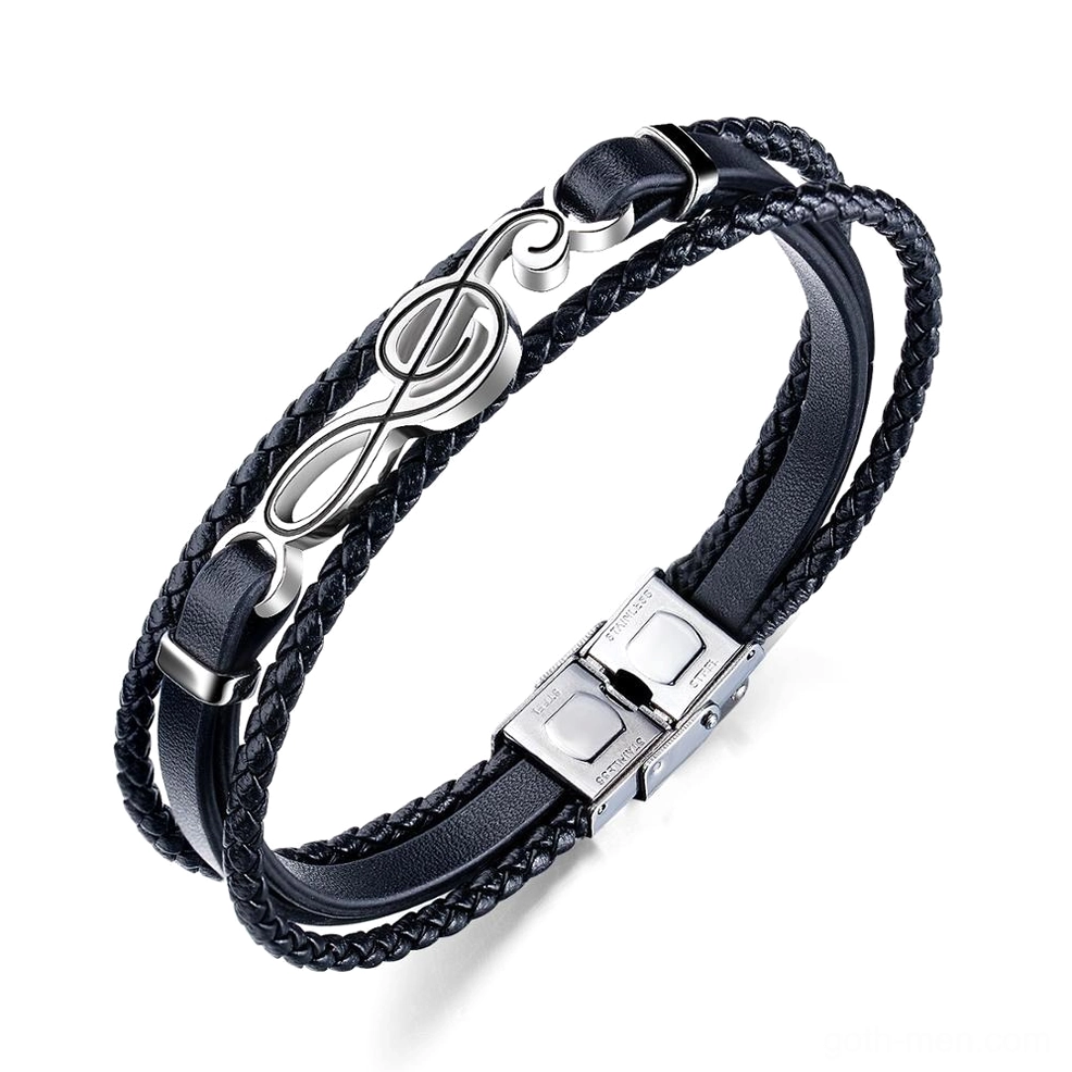 Black treble clef leather bracelet flat lay overhead view showing braided multi-strand PU leather construction with stainless steel music symbol charm gothic mens jewelry