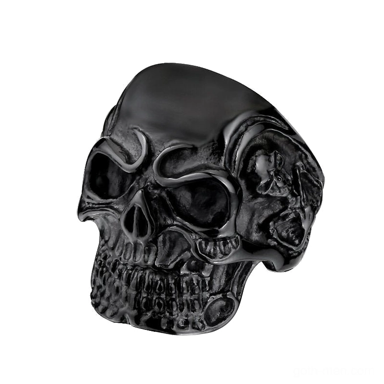 Matte black stainless steel triple skull gothic ring with carved skull details - studio front view