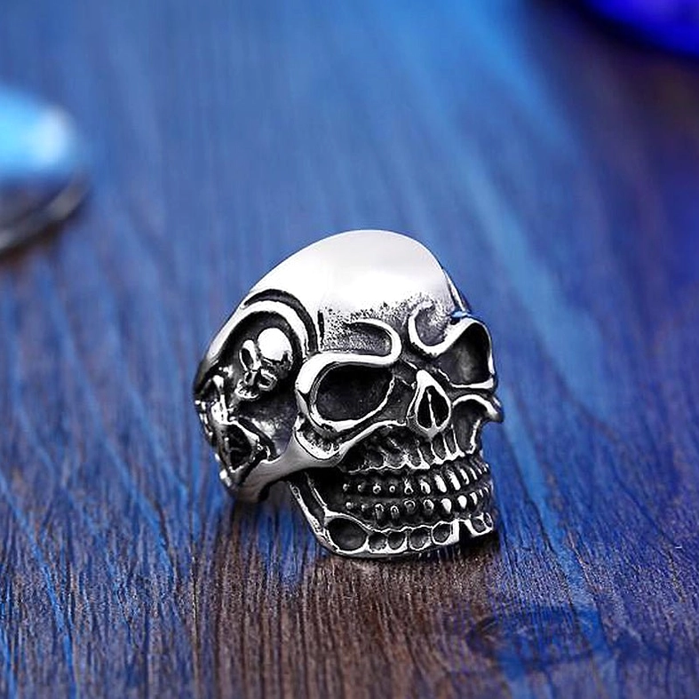 Triple skull gothic ring front center view highlighting main skull prominence