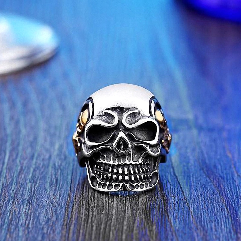 Triple skull gothic stainless steel ring worn view detail shot
