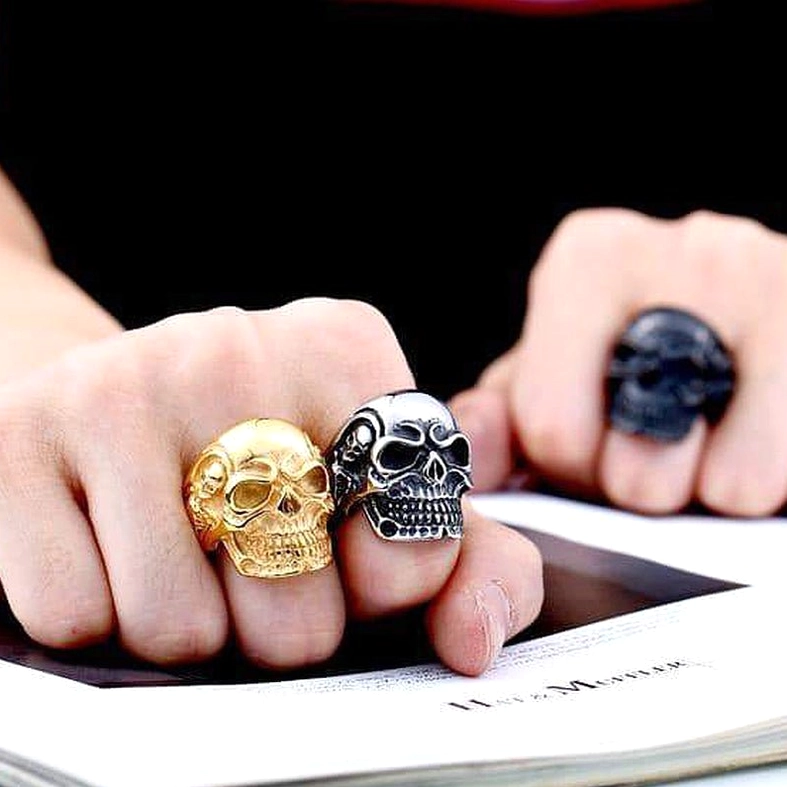 Steel color triple skull gothic ring variation front display view