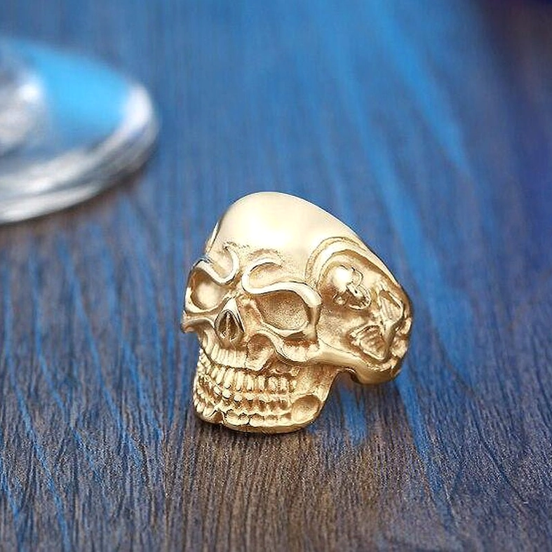 Triple skull gothic ring tilted angle view of skull carving dimensions