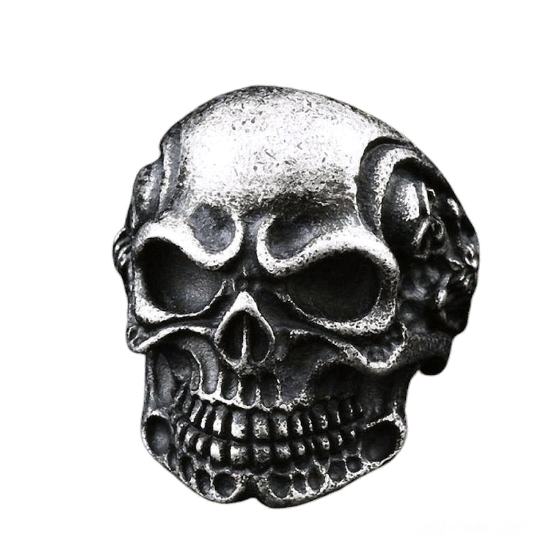 Aged dark gray vintage triple skull gothic ring with detailed skull carving - overhead front view