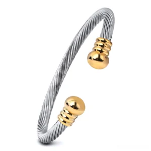 Two-tone twisted cable open cuff bracelet with silver and gold end caps, gothic jewelry design