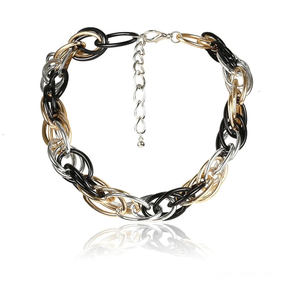 Tri-color twisted curb chain gothic necklace flat lay with metal reflections and adjustable extension