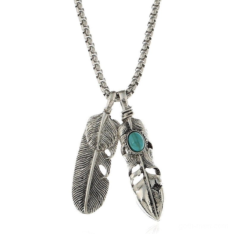 Two-leaf feather pendant necklace with turquoise inlay, side view showing detailed feather pattern and claw accent