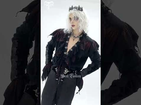 Black gothic vampire shirt on male model, front cropped view with open ruffled placket and decorative waist belt