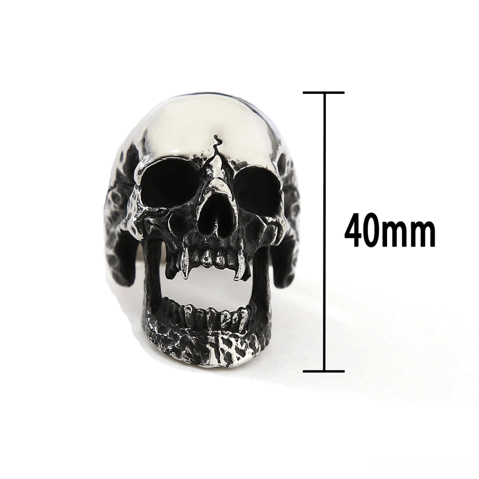 Vampire skull gothic ring 40mm width front-facing view showing two-tone fanged skull design with distressed blackened jaw texture on white background
