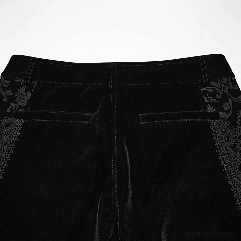 Close-up detail of black velvet pants back waist showing floral embroidery, belt loops, and velvet texture