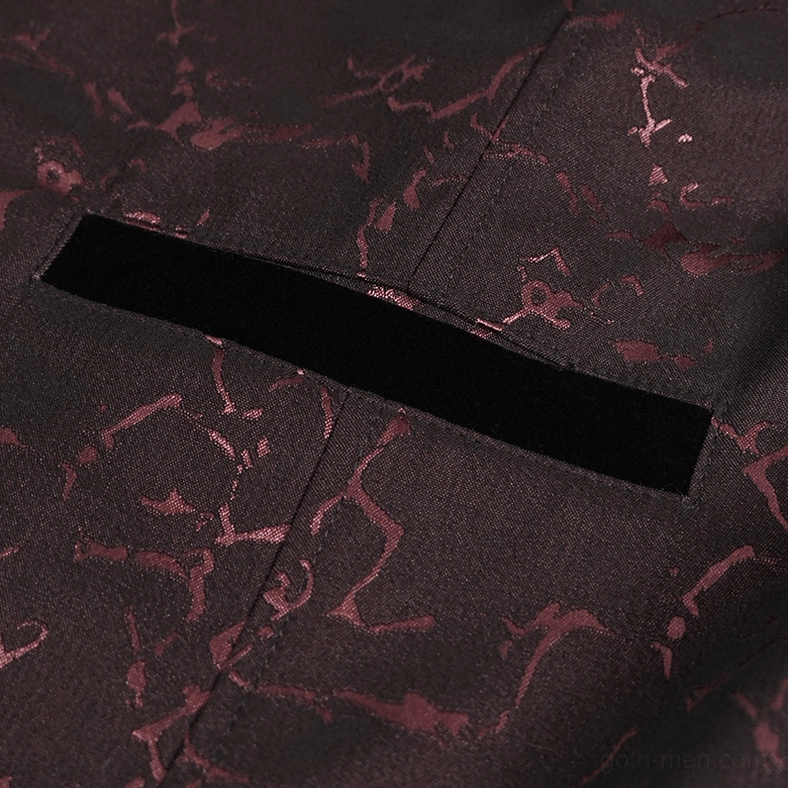 Velvet-trimmed slit pocket detail showing jacquard fabric texture of gothic tailcoat