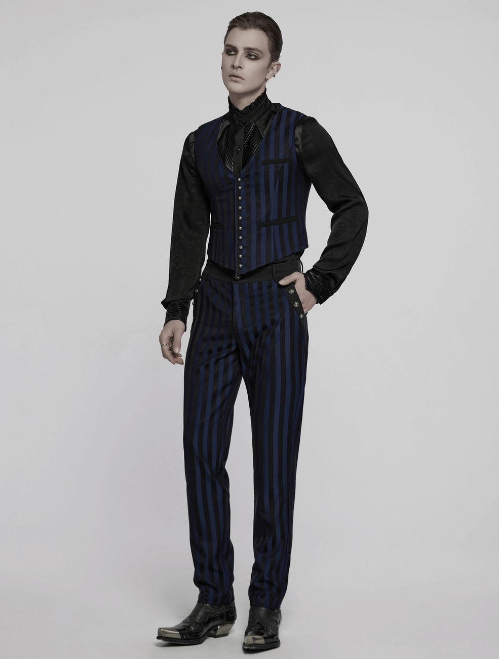 Black-blue gothic vertical stripe trousers detail showing slim fit architecture and stripe continuity