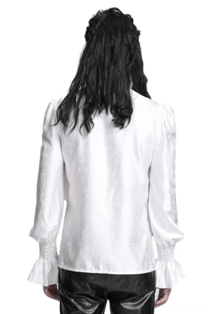 Victorian gothic ruffled white shirt rear view on male model with long black hair, showing back panel with jacquard texture and puff sleeves layered with faux leather goth styling