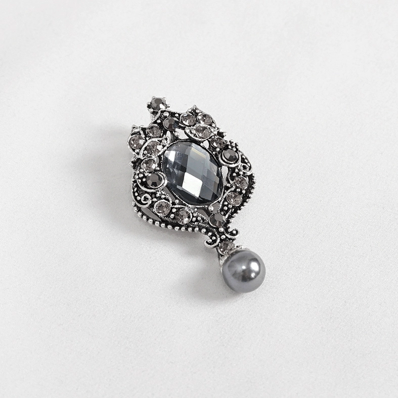 White Victorian-inspired ascot tie with crystal brooch goth aesthetic styling
