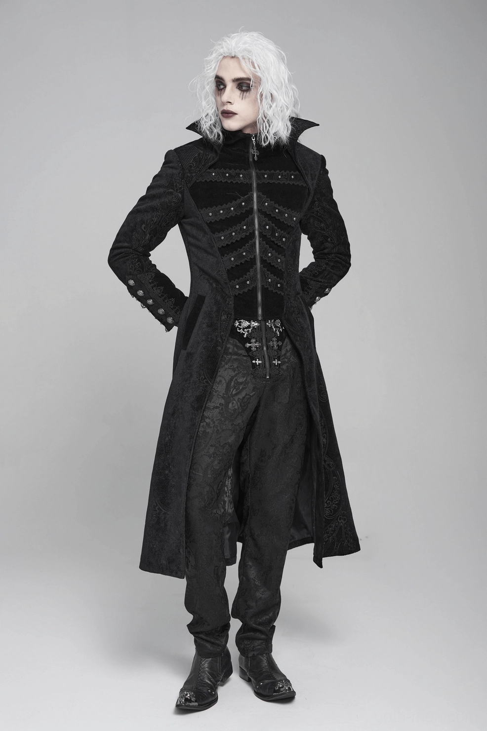 Black Victorian gothic tailcoat on model three-quarter view, displaying full silhouette with brocade and fitted construction