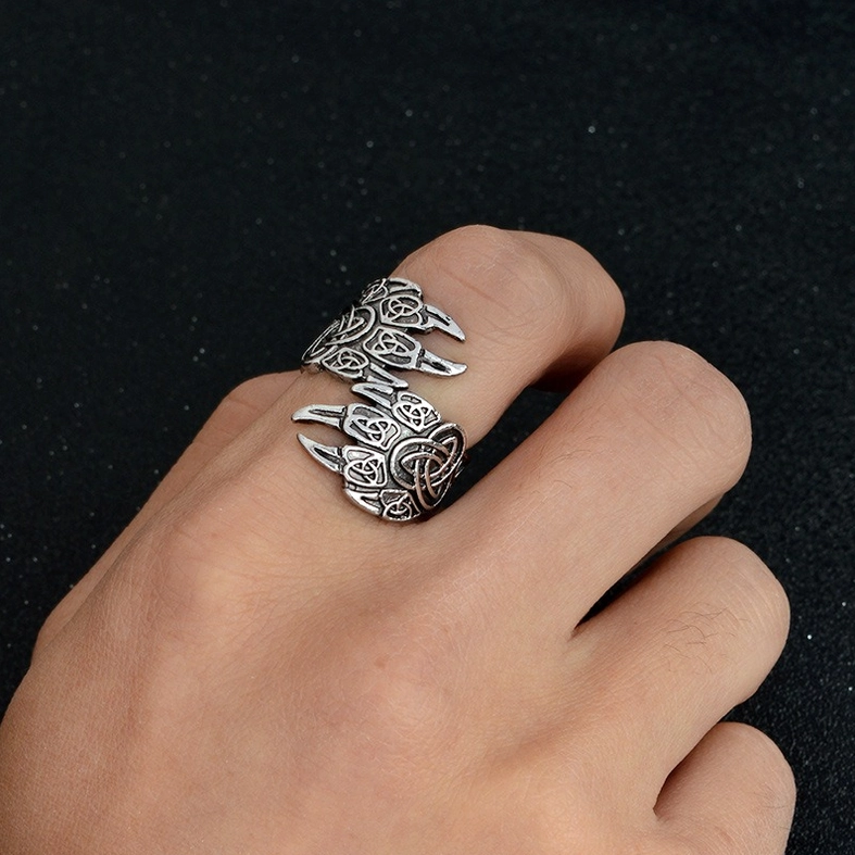Viking bear claw stainless steel ring worn on hand - lifestyle photo showing authentic fit across two fingers with silver tone against dark background