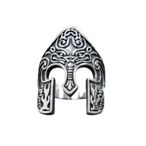 Nordic warrior helmet gothic ring in antique silver with embossed totem carvings, flat lay front view