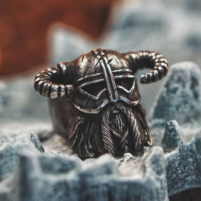 Viking horned ring front low-angle view - carved helmet and beard design detail with gothic aesthetic
