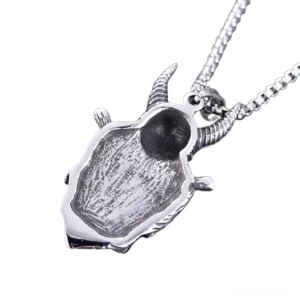 Viking skull pendant back view - hollow carved design showing craftsmanship - gothic jewelry detail