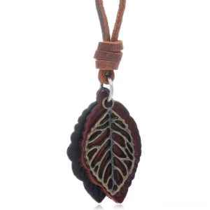 Dark vintage leather leaf pendant necklace with double layered leaves and hollow bronze metallic accents - flat lay view