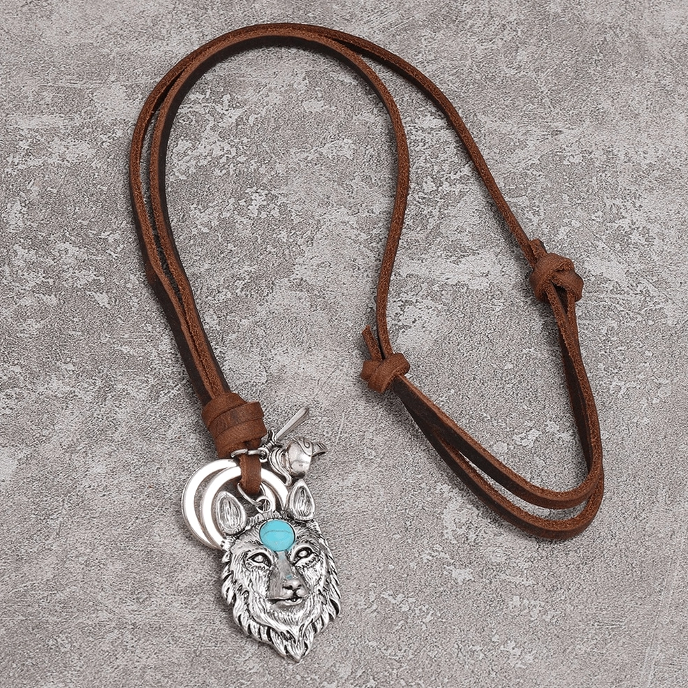 Full length adjustable brown leather rope necklace with wolf head pendant flat lay