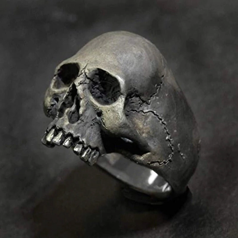 Vintage skull ring front close-up revealing detailed facial features and patinated silver tone