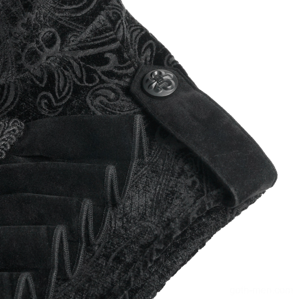 Macro photography of black velvet gothic waistcoat showing embossed damask weave and metal decorative button hardware