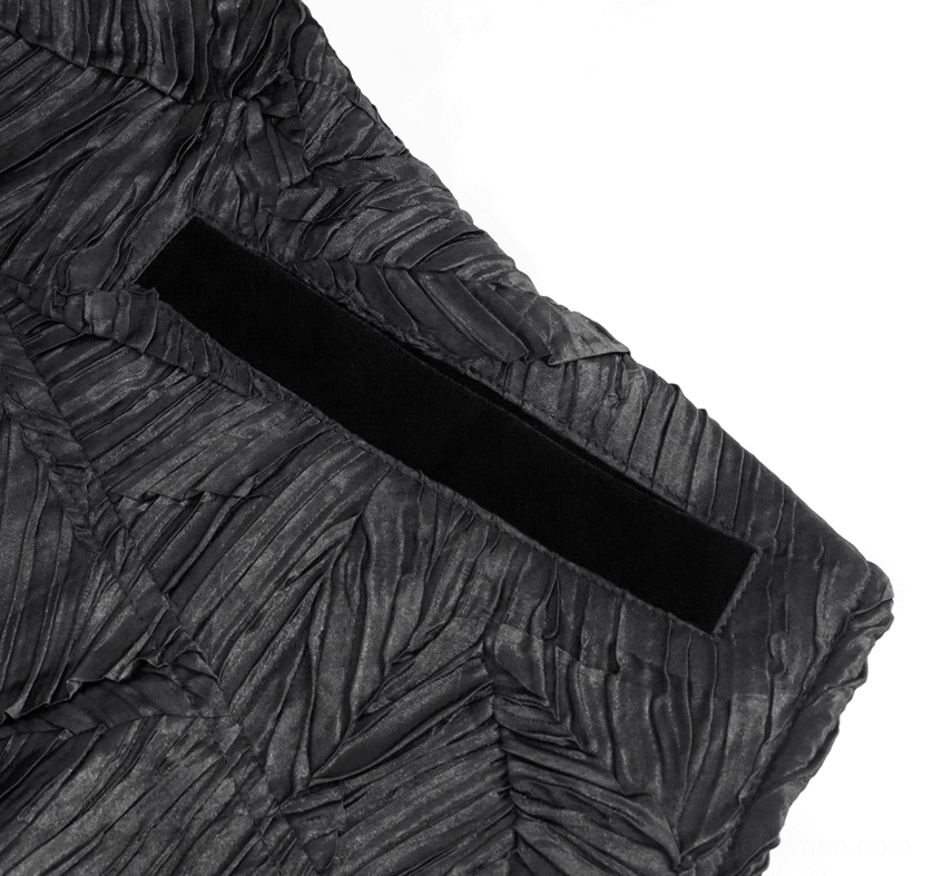 Black gothic waistcoat side close-up showing velvet trim strip and crinkled leaf texture pattern