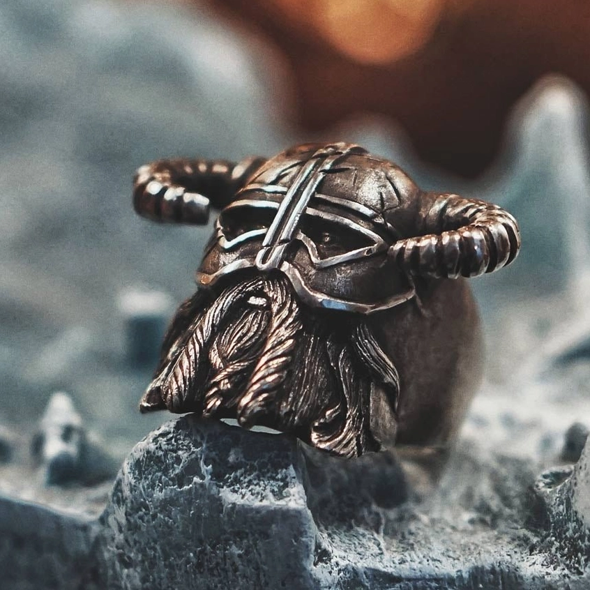Nordic warrior ring low-angle view - bronze-toned vintage metal with intricate carved helmet and beard