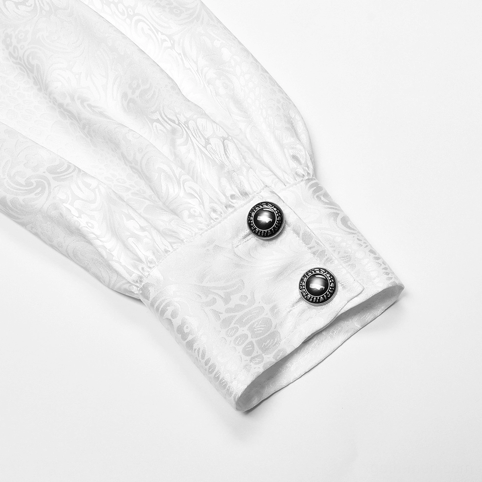 Close-up of white gothic blouse bishop sleeve cuff with metal round buttons and jacquard texture