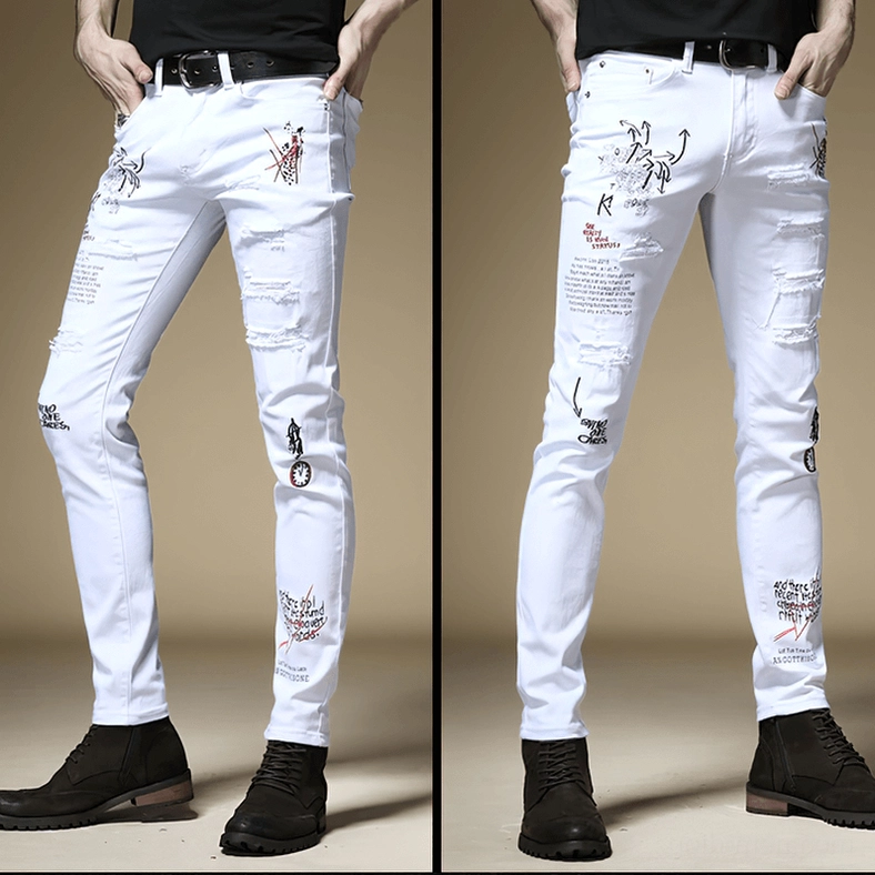 White gothic slim ripped jeans front side view with graffiti prints and distressed holes