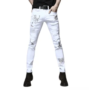White gothic slim jeans with graphic graffiti prints and ripped details worn by male model, front view