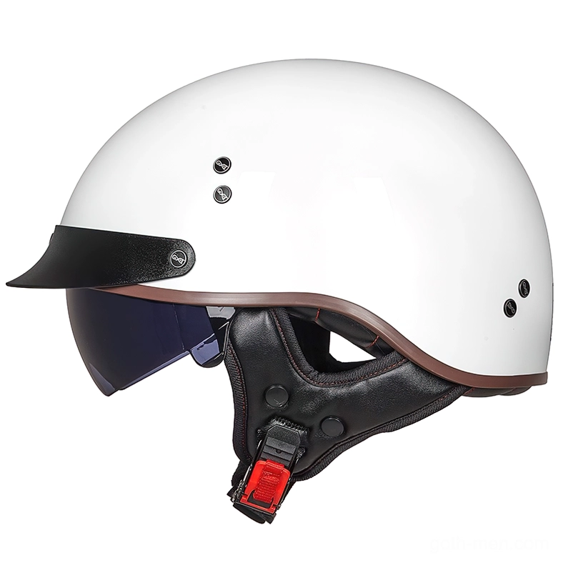 Vintage half-face biker helmet in bright white with black visor and red quick-release safety buckle, front three-quarter studio view showing glossy finish and gothic minimalist design