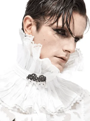 Right side profile of white gothic ruffled collar with vintage black brooch and dangling pearl decorations on male model