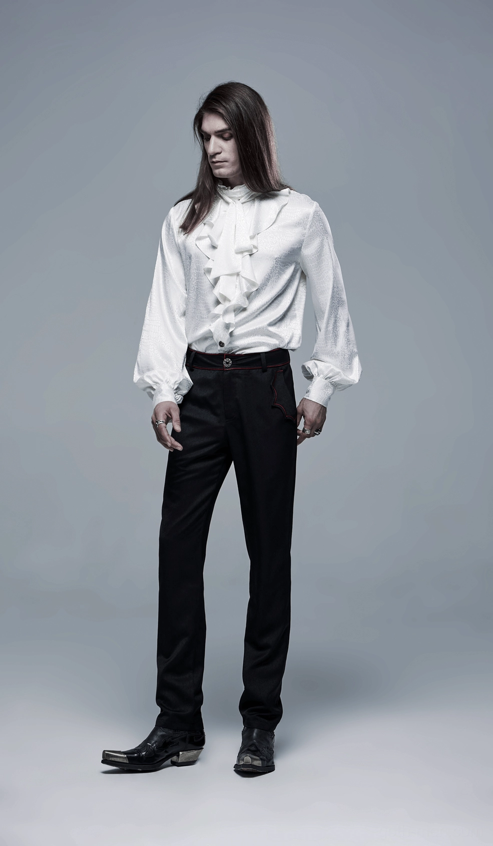 White gothic ruffled blouse on model showcasing standing ruffled collar and button front