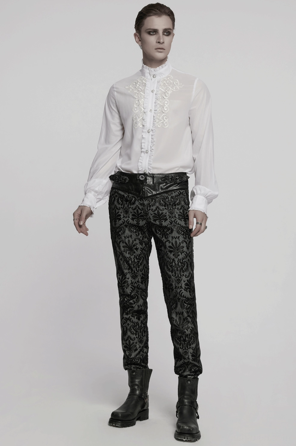 Detailed product shot of white gothic ruffle shirt highlighting embroidered front panel and theatrical collar design