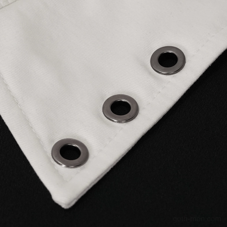 Close-up detail of metal grommet eyelets on white cotton gothic punk shirt fabric