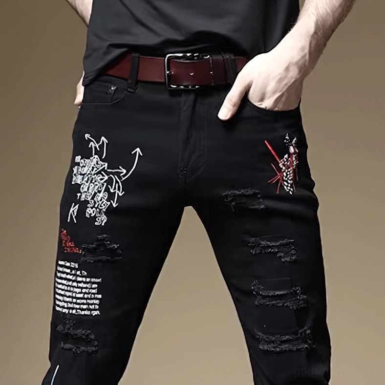 White gothic slim ripped jeans front view showing letter prints and distressed design details