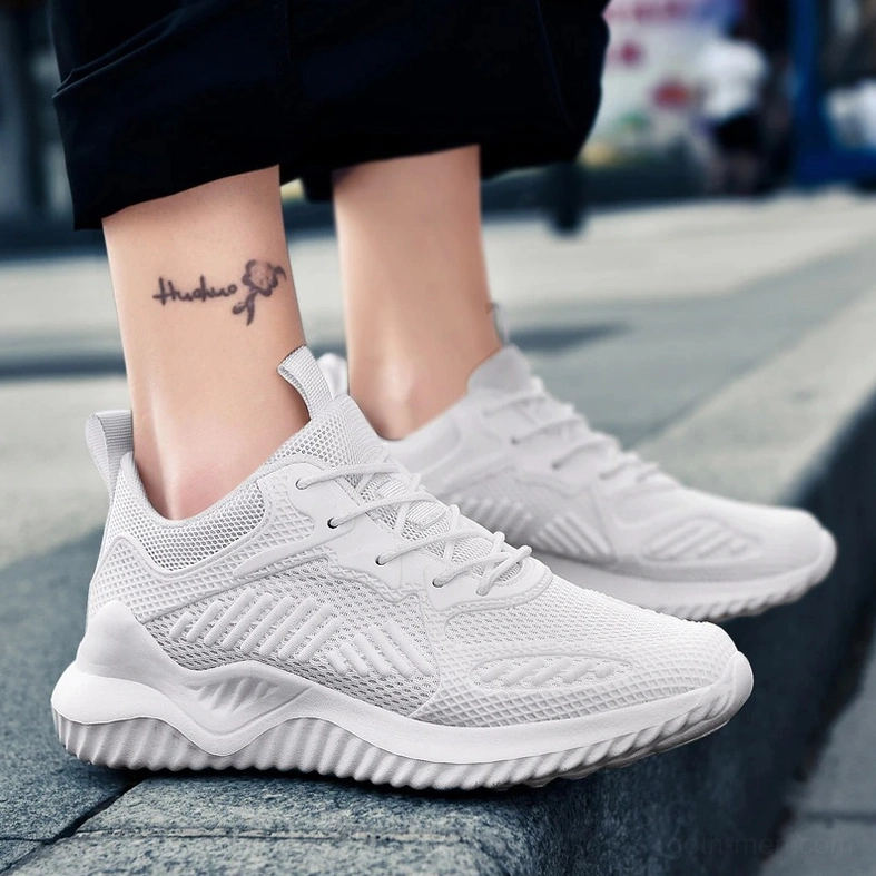 White mesh gothic sneaker street worn styling with tattooed wearer - alternative lifestyle