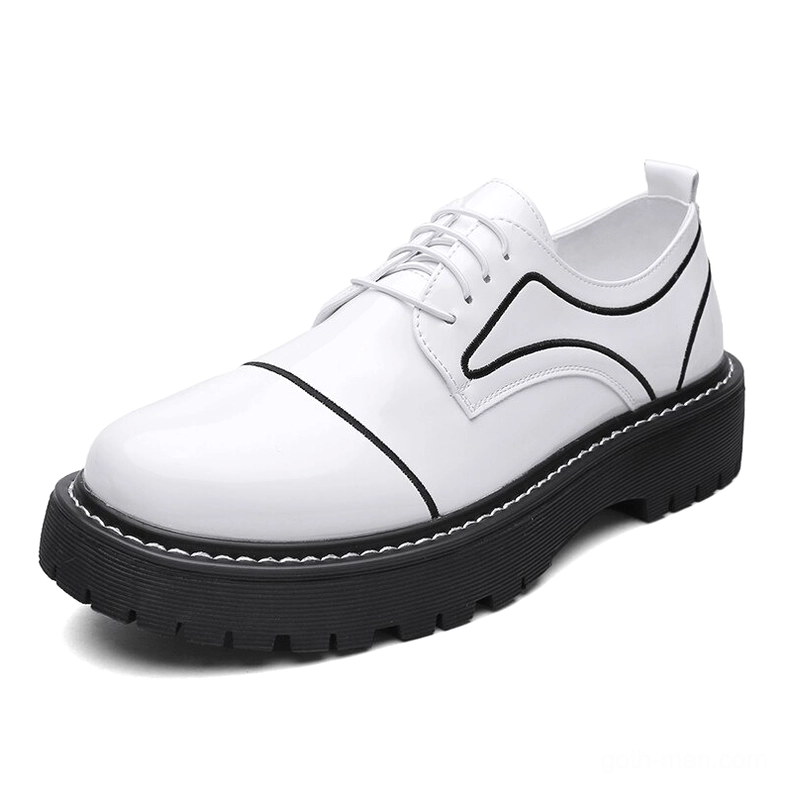 White patent leather men's oxford platform shoes with black thick sole, minimalist studio view
