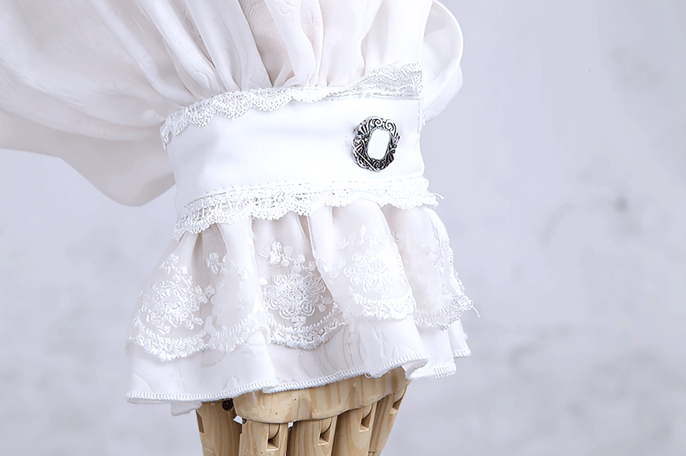 White ruffle formal dress shirt front panel detail showing vertical button closure and jabot layering