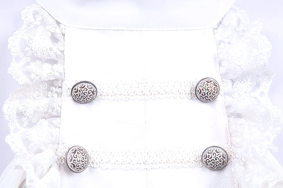 White gothic ruffle men's shirt front placket close-up showing layered lace ruffles and vintage metal button rows