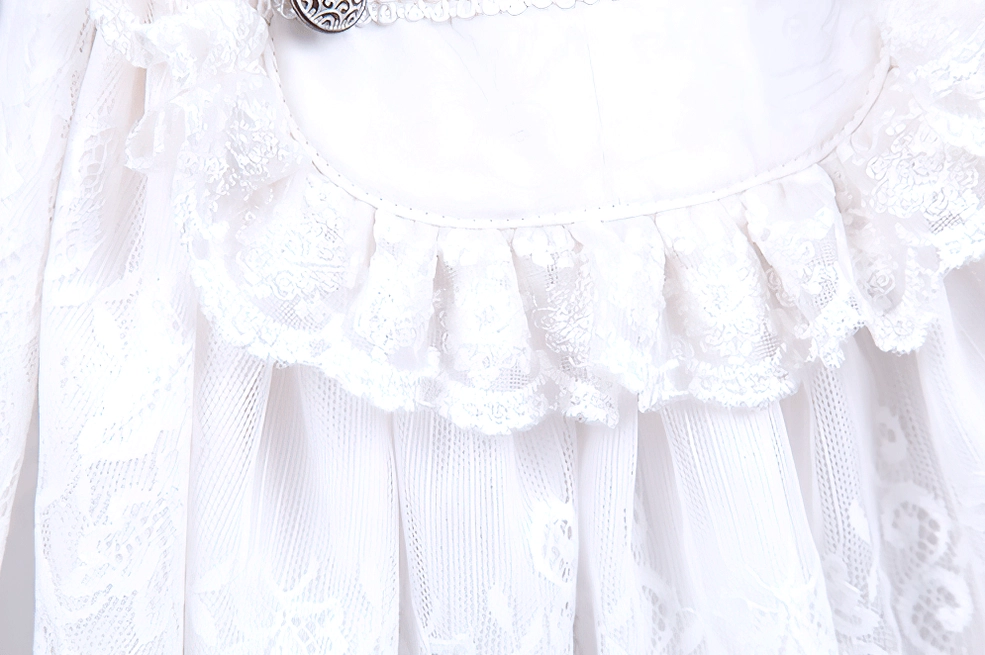 White ruffle dress shirt sleeve detail showing bishop sleeve cuff with ruffled edge and button closure