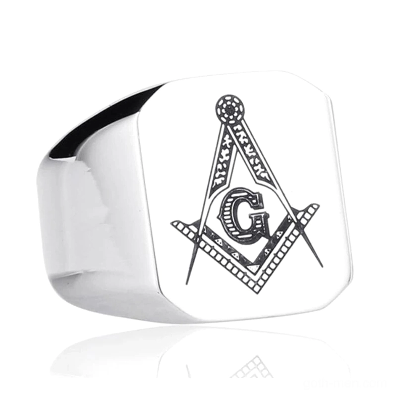 Wide silver Masonic signet ring side view showing detailed engraved Freemasonry emblem with surrounding text, gothic band