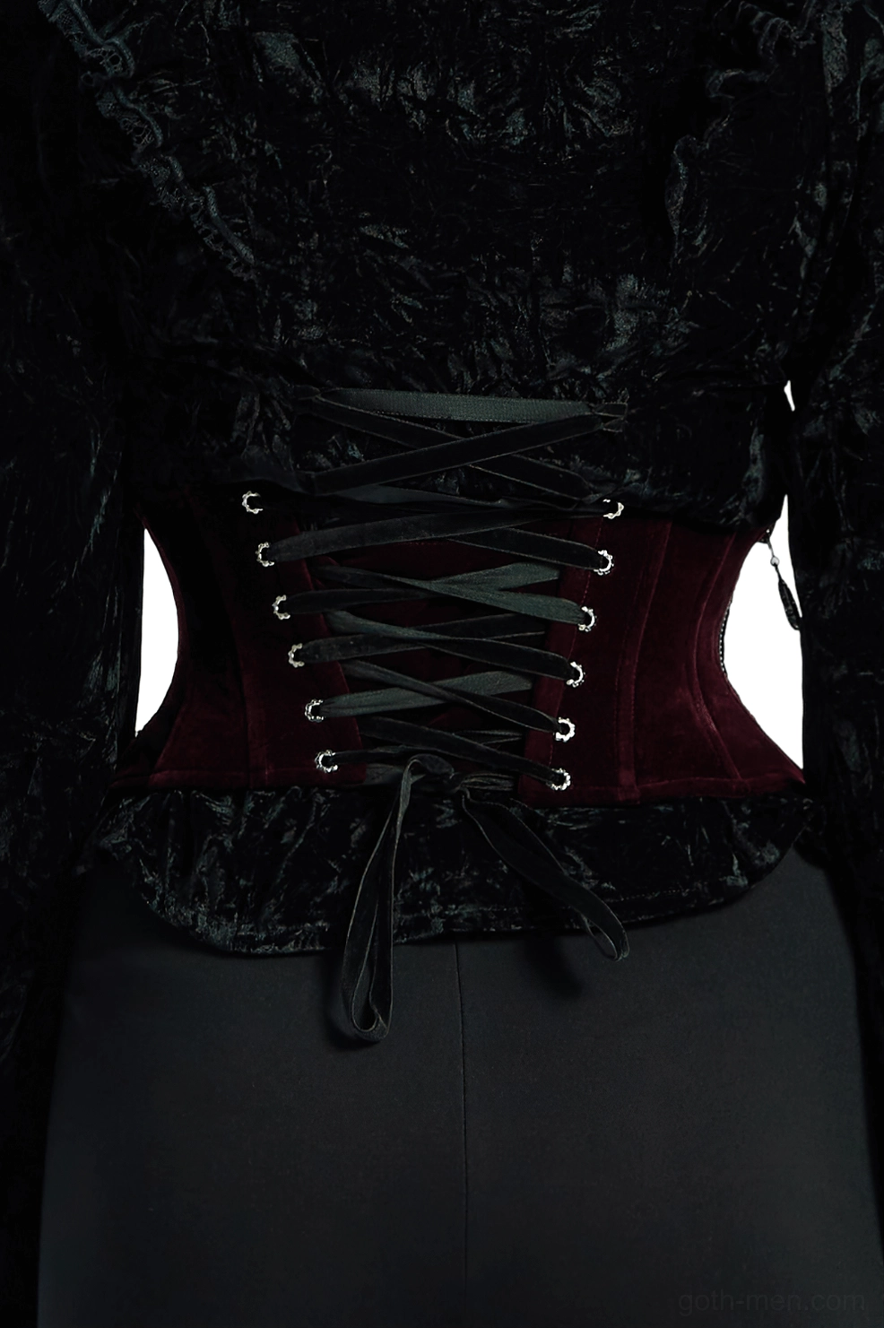 Back view of burgundy velvet gothic underbust corset showing adjustable eyelet-laced closure and black ribbon tie
