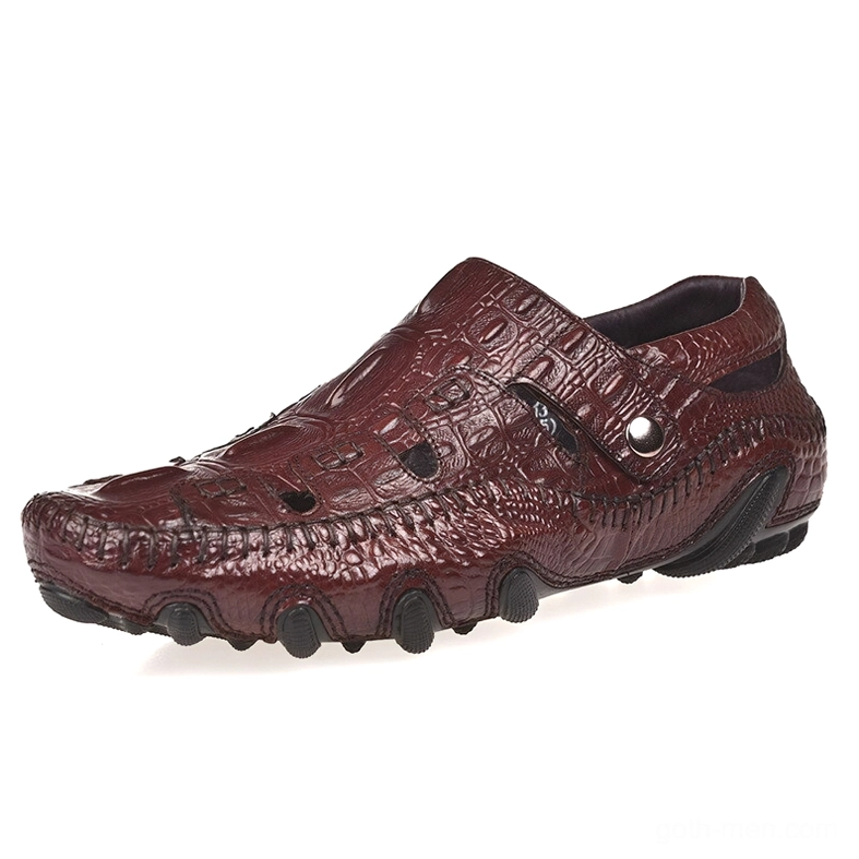 Wine red gothic crocodile-embossed leather loafers for men, side profile view showing metal buckle strap and textured reptilian leather detailing